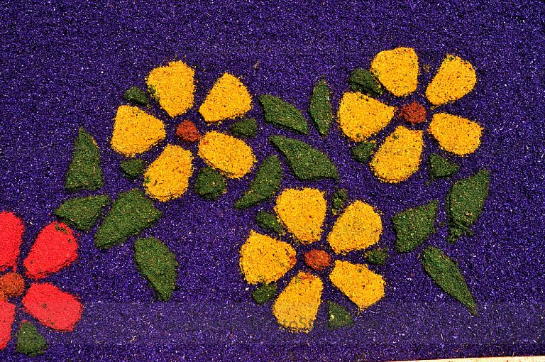 Detalle de alfombra de aserrín
